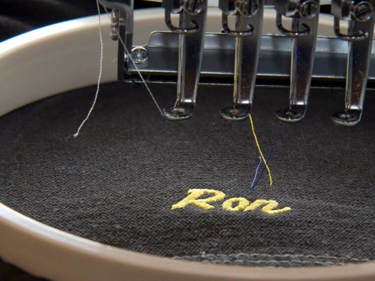 Embroidery machine sewing a name